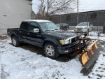 2001 Toyota Tacoma PreRunner RWD with snow plow, 82,000 miles, parked in winter conditions.