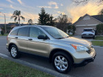 2007 Honda CR-V for sale, gold color, parked on street with clean exterior and great condition.