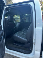 Interior view of a 2006 Chevrolet Silverado 1500 showing back seats and door access