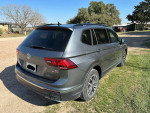 2018 Volkswagen Tiguan SE 4Motion AWD in gray with all-wheel drive, parked on a grassy area.