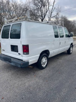 2008 Ford E-150 cargo van with ladder racks, good condition, available for $5400 cash.