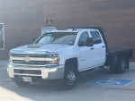 2017 Chevrolet Silverado 3500HD Dually flatbed truck in excellent condition, showcasing its robust design and clean exterior.