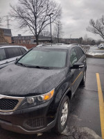 2013 Kia Sorento for sale with 108,000 miles, showcasing exterior and surroundings, damaged switch from attempted theft.