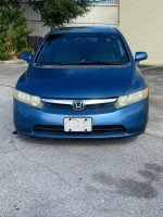 Front view of a blue 2008 Honda Civic EX FWD for sale with 93,000 miles in good condition.