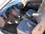 Interior view of a 1997 Acura CL showing the dashboard and leather seats.