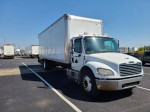 2009 Freightliner 26' box truck M2 with liftgate parked in a lot, showcasing its clean title and safety features.