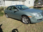 2009 Ford Fusion in good condition with a dent, suitable for daily commuting or ride services.