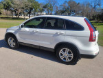 2011 Honda CR-V EX-L with 53,000 miles parked in a sunny outdoor setting, featuring a sleek design and alloy wheels.