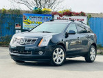 2015 Cadillac SRX Premium FWD parked, features clean CarFax, fully loaded with navigation and safety sensors.