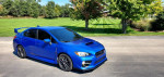 2017 Subaru WRX Limited AWD in World Rally Blue, showcasing sleek design and sporty features in excellent condition.