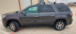 2013 GMC Acadia SLT in gray color with clean leather interior and roof rack, parked outside.