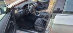Interior of a 2013 Volkswagen CC Sport with black leather seats and modern dashboard features.