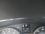Dashboard display showing mileage of 142,411 in a 2010 Subaru Legacy Outback