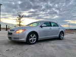 2011 Chevrolet Malibu LT sedan in silver with leather interior and sunroof, parked outdoors