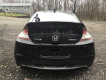 Rear view of a black 2012 Honda CR-Z Hybrid with damage for sale, located in a rural area.