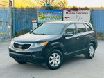 2013 Kia Sorento LX FWD in black, showcasing alloy wheels and a well-maintained exterior.