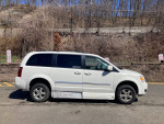 2009 Dodge Grand Caravan handicap mobility van with side entry and in-floor ramp parked outdoors