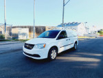 2013 Ram C/V Tradesman Cargo Van with roof racks, 127,000 miles, parked on the street