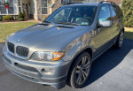 2006 BMW X5 3.0i AWD in Stratus Metallic with aftermarket features, parked on driveway