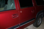 2001 Chevrolet Suburban door detail, showcasing original paint without rust, highlighting excellent condition.