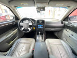 Interior view of a 2006 Chrysler 300 Touring with leather seats and touchscreen display