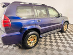 2008 Lexus GX 470 4WD in blue with new bronze off-road wheels and all-terrain tires for sale.