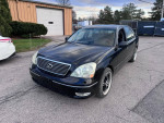 2002 Lexus LS 430 luxury sedan with navigation system and leather seats, parked outdoors.