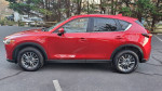 2017 Mazda CX-5 SUV in red parked, featuring leather interior and sunroof