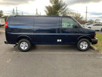 2016 Chevrolet Express cargo van with 124,000 miles, excellent condition, blue paint and ladder racks.