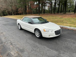 2006 Chrysler Sebring Touring Edition convertible parked on a road, well-maintained with new tires and brakes.