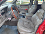Interior view of a 2001 Jeep Grand Cherokee Limited with leather seats and power features