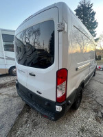 2016 Ford Transit 350 van with high roof and sliding side door, showing rear view and body condition.