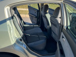 Interior view of a used 2007 Nissan Sentra showing rear seats and door details, featuring clean upholstery and space.
