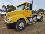 2008 Freightliner Columbia CL120 truck with rebuilt engine, new transmission, and tires parked on dirt road.