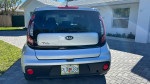 Rear view of a 2017 Kia Soul parked in a driveway, showcasing its clean design and new features.