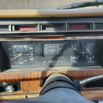Dashboard of a classic 1984 Ford F250 with gauges and controls, ideal for a restoration project.