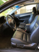 Interior view of a 2007 Honda Accord EX-L Coupe with black leather seats and sunroof.