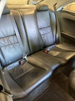 Interior view of the back seat in a 2007 Honda Accord EX-L Coupe with leather upholstery.