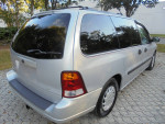 2002 Ford Windstar LX minivan with wheelchair lift, low mileage, and clean exterior for sale.