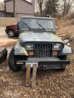 1994 Jeep Wrangler with hard and soft tops, green cameo paint, and great tires, for sale at $3950