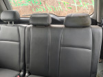 Rear seating area of a 2003 Honda Pilot with leather upholstery and headrests