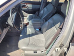 Interior view of a 1999 Mercedes S420 showcasing leather seats and steering wheel.