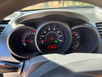 Dashboard view of a 2013 Kia Soul with speedometer and temperature gauges, showing excellent condition.