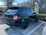 2009 Land Rover Range Rover Supercharged in black, parked outside with sleek design and premium features.
