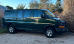 Green 2010 Chevrolet Express cargo van with 140,000 miles, well-maintained, for sale as is.