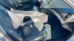Interior of a 2013 Infiniti G37 Journey showcasing black leather seats and modern dashboard controls.