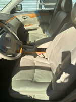 Interior view of a 2005 Lexus ES with leather upholstery and wooden accents.