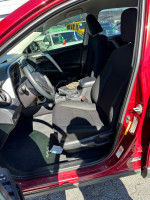 Interior view of a 2018 Toyota RAV4 showing the front seats and dashboard