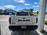 2022 Ram Rebel truck with 7300 miles parked outside a home under clear blue sky.