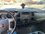 Interior view of a 2008 GMC Sierra SLE showing dashboard and controls, with signs of wear.